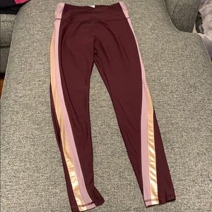 Maroon leggings with gold stripe
